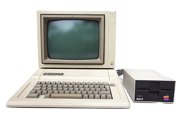 An Apple IIe with disk drive and monitor