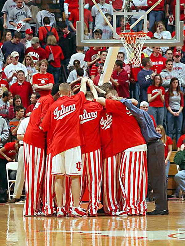 Players huddle before a game in their iconic candy striped pants