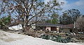 Tipped buildings and levee repair materials near the breech