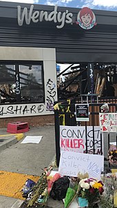 Memorial for Brooks at the place of his death Memorial for Rayshard Brooks outside burnt down Wendys.JPG