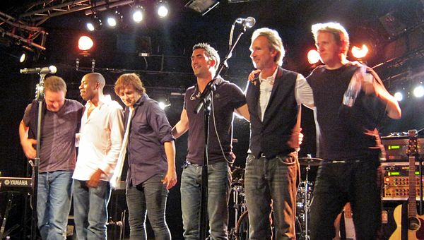 Mike + The Mechanics in concert in July 2012 L-R: Ben Stone, Andrew Roachford, Tim Howar, Luke Juby, Mike Rutherford and Anthony Drennan