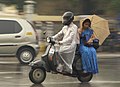 Monsoon couple on motorcycle.jpg