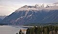 Snow-covered Copper Mountain behind Mount Rose, from Lake Cushman.