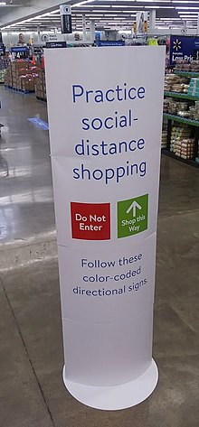 Sign announcing implementation of one-way shopping lanes at Newburgh Walmart One-way shopping sign at Walmart during COVID-19 pandemic, Newburgh, NY.jpg