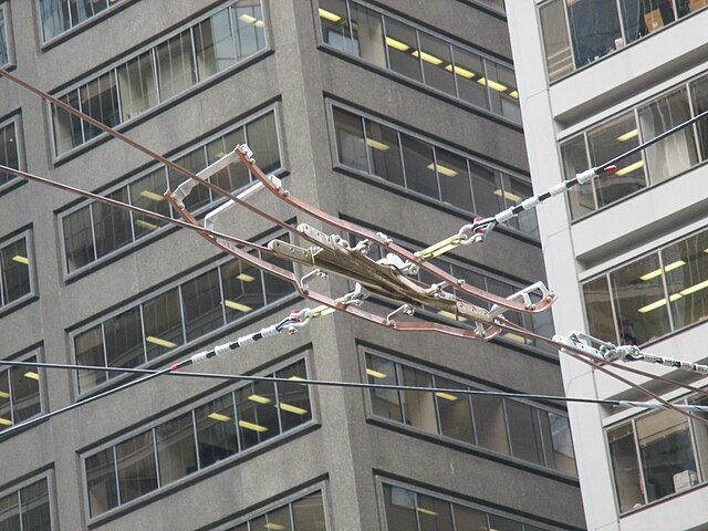 Overhead over a switch in Toronto: Two runners for pantographs flank the trolley pole frog.