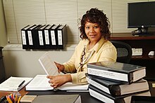 A paralegal in 2004, photo distributed by NARA Paralegal and Legal Assistant - DPLA - 61c98374b371fbaef5b835e3d2f54de3.jpg