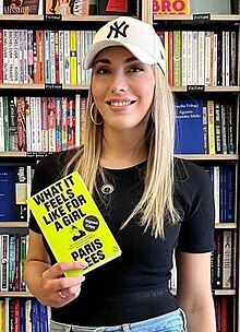 Paris Lees at the Brick Lane Bookshop in London holding her book 'What It Feels Like For A Girl' in 2022. Paris Lees (cropped 1).jpg