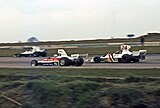 Mark Donohue leading Hunt at the 1975 British Grand Prix.
