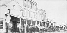 View of NE side of Main St, frame building built in 1830 by John Miller