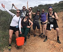 Plogging group picking up litter and trash