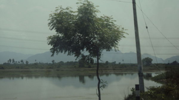 Podhigai mountain's shadow falling on Poovankurichi lake.