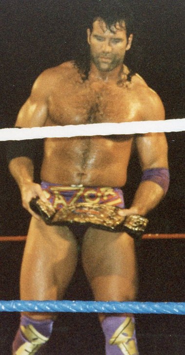 Ramon holding the Tag Team Championship at a WWF event