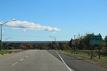 Looking east at the sign for Rice Lake on WIS 48 Rice Lake Wisconsin Sign WIS48 Looking East.jpg