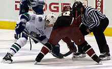 Johnson taking a faceoff against the Phoenix Coyotes in 2009. Ryan Johnson faceoff.jpg