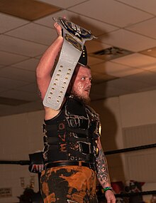 Callihan as the Alpha-1 Outer Limits Champion Sami Callahan Outer Limits title.jpg