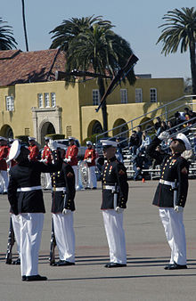 The U.S. Marine Corps Silent Drill Platoon performs the rifle inspection routine in front of spectators seated in the Reviewing Stands during the Battle Colors Ceremony held at Marine Corps Recruit Depot San Diego, California. Silent Drill Platoon Rifle Inspection Routine.jpg