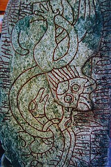 A flying dragon in a dive found on the Sparlosa Runestone (c. 800). Sparlosastenen.JPG