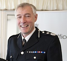 Beckley in 2013 Special Constable with Lord Taylor and Rob Beckley (9136803850) (Beckley cropped).jpg