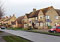 The Nelson Club. The neighbouring building is the village hall and beyond are yellow brick terraced cottages