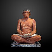 The Seated Scribe; 2613–2494 BC; painted limestone and inlaid quartz; height: 53.7 cm
