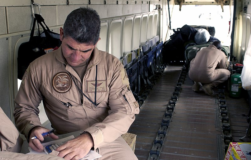 File:U.S. Army (USA) STAFF SGT. Ray Thomas (left) from Company H, 171st Aviation Regiment, Georgia Army National Guard, checks a load list while calculating the weight of his C-23B Sherp - DPLA - 1a53718a3404dbd42c7e637fc67e0cff.jpeg