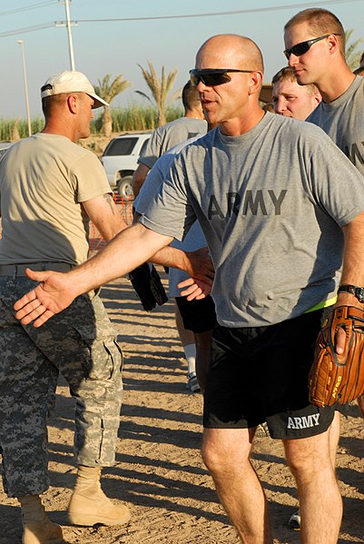 File:US Army 51604 BAGHDAD - Second Lt. Stuart Redus, a platoon leader, from San Antonio, congratulates players at a softball tournament celebrating Hispanic Heritage Month, Sept. 24. Though his team lost, he enjoyed h.jpg