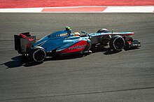 The MP4-27 with a Verizon logo at the 2012 United States Grand Prix United States Grand Prix - Qualifying (8194871186).jpg