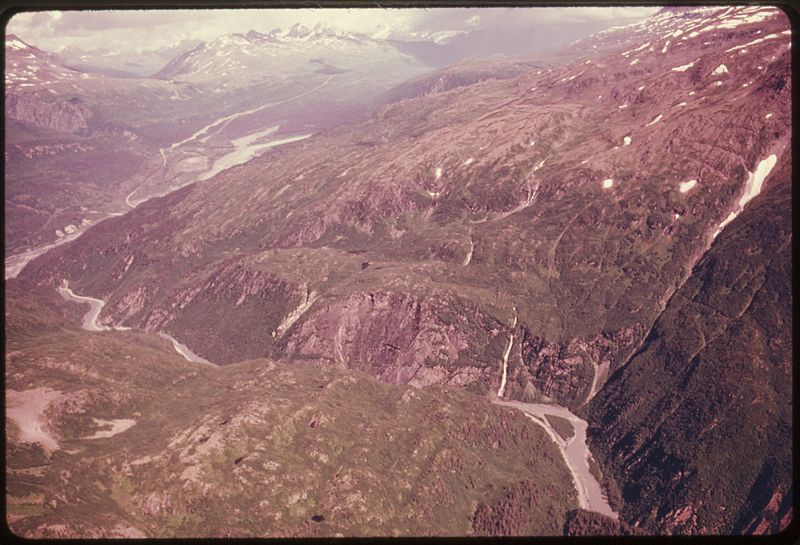 File:VIEW EAST SHOWING THOMPSON PASS, THE GENTLY CURVED NOTCH IN THE UPPER LEFT OF THE PICTURE, THE SITE OF THE SHEEP... - NARA - 555678.jpg