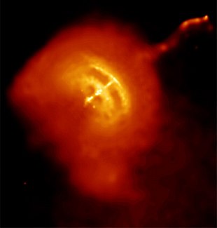 Vela Pulsar is the bright point in the middle, surrounded by a pulsar wind nebula, in which plasma shock waves and radial jets can be seen.