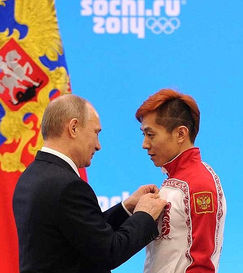 Vladimir Putin and Ahn after the 2014 Olympics