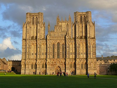 An image of the facade of Wells Cathedral currently in use. Two architects successively have made each stage smaller so that the towers taper. The effect is to 'maximise vertical perspective.