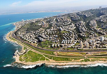 Mount Carmel touching the sea - Kiryat Sprinzak and Ein HaYam neighbourhoods, with Hecht Park (bottom right) Western Haifa from the air.jpg