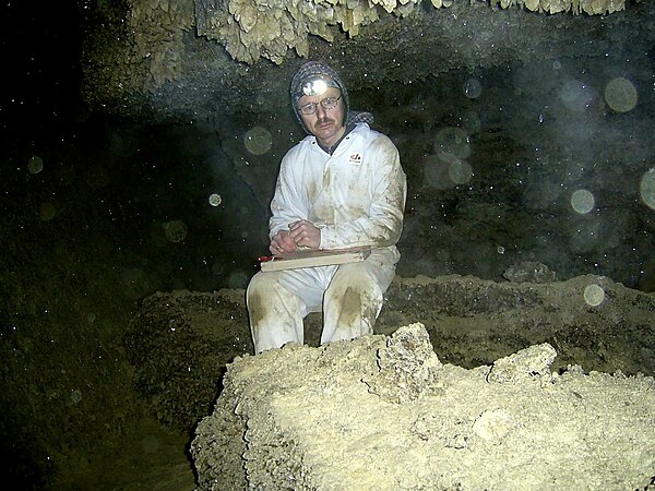 Speleologist Pavlo Kuprich maps the measurements of the cave's labyrinths. Photo by Площанський Петро