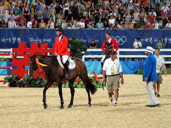 Madden riding Authentic (left) at the 2008 Olympic Games ceremony