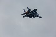 An F-15E Strike Eagle, tail number 91-0302, taking off from RAF Lakenheath in England. The aircraft is assigned to the 492nd Fighter Squadron.