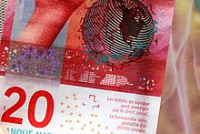 Fine print of a CHF 20 banknote, with distances between earth and various celestial bodies in light-seconds 20 CHF banknote (2017).jpg