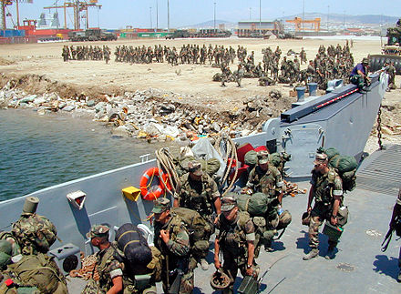 Marines loading on a Landing Craft Utility in 1999