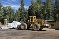 A frontloader deposits a multi-ton, freshly quarried block of white marble at the processing facility owned by Colorado Stone Quarries in the aptly named town of Marble in Gunnison County, Colorado LCCN2015633932.tif