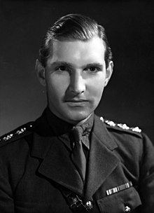 black and white formal portrait of man in military uniform