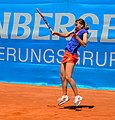 Ana Vrljić hitting a forehand during 1st round doubles match with Ilona Kremen against Raluca Olaru and Shahar Pe'er at the 2014 Nürnberger Versicherungscup