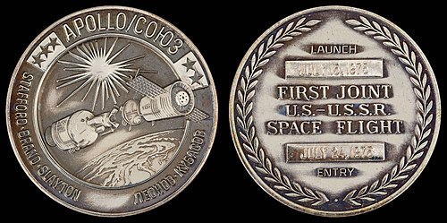 Apollo-Soyuz Test Project mission emblem and crew names in English and Russian (front). Dates (launch and entry) (back)