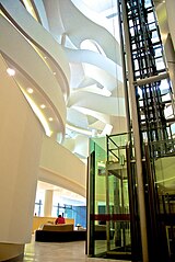 Charles Perkins Centre interior atrium showing the glass elevator
