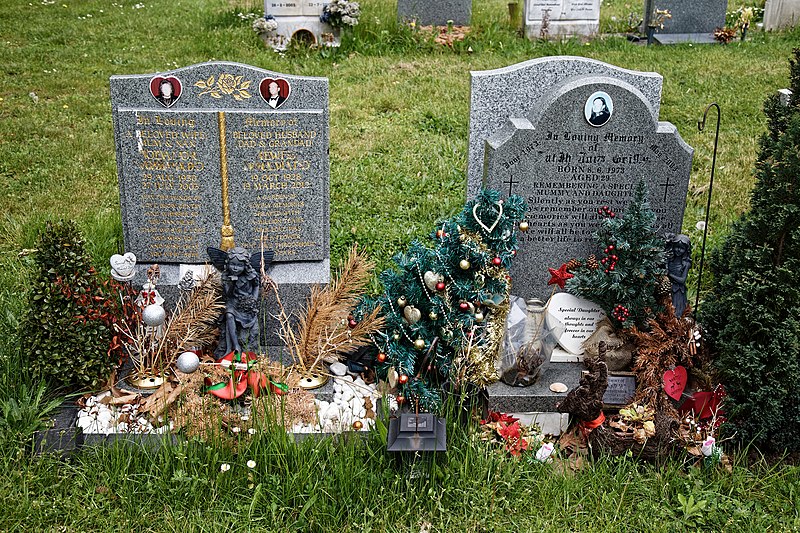 File:City of London Cemetery modern gravestones 4 plastic Xmas trees and artifacts.jpg