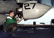 TARPS personnel attending to forward camera bay Crew inspecting TARPS digital camera.jpg