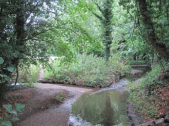 Confluence of Folly Brook (left) with Dollis Brook Dollis Brook Folly Brook.JPG