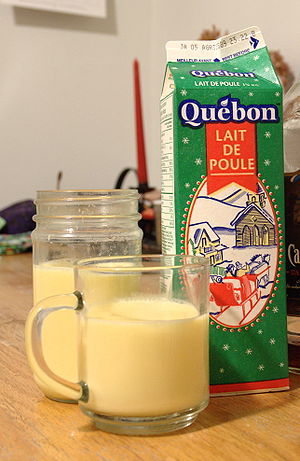 Glasses and a carton of eggnog (called by its ...
