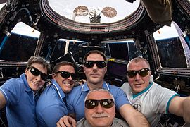 Yurchikhin (bottom centre) pictured with the rest of the Expedition 51 crew in the Cupola.