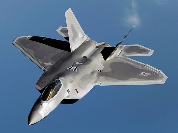 An F-22 Raptor flies over Kadena Air Base, Japan on a routine training mission in 2009.