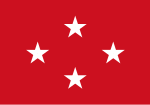 Ortalanmış bir baklava biçiminde dört beyaz beş köşeli yıldızla kırmızı bayrak