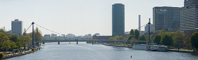 Frankfurt on the Main: Holbeinsteg (Holbein Bridge) with Westhafen Tower (West Harbour Tower) as seen from the Untermainbruecke (Lower Main Bridge)